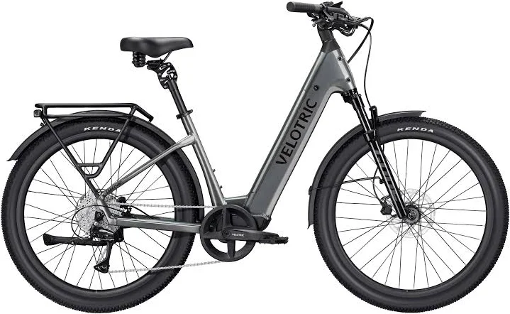 Step-through electric bicycle with pedals, battery and rear rack